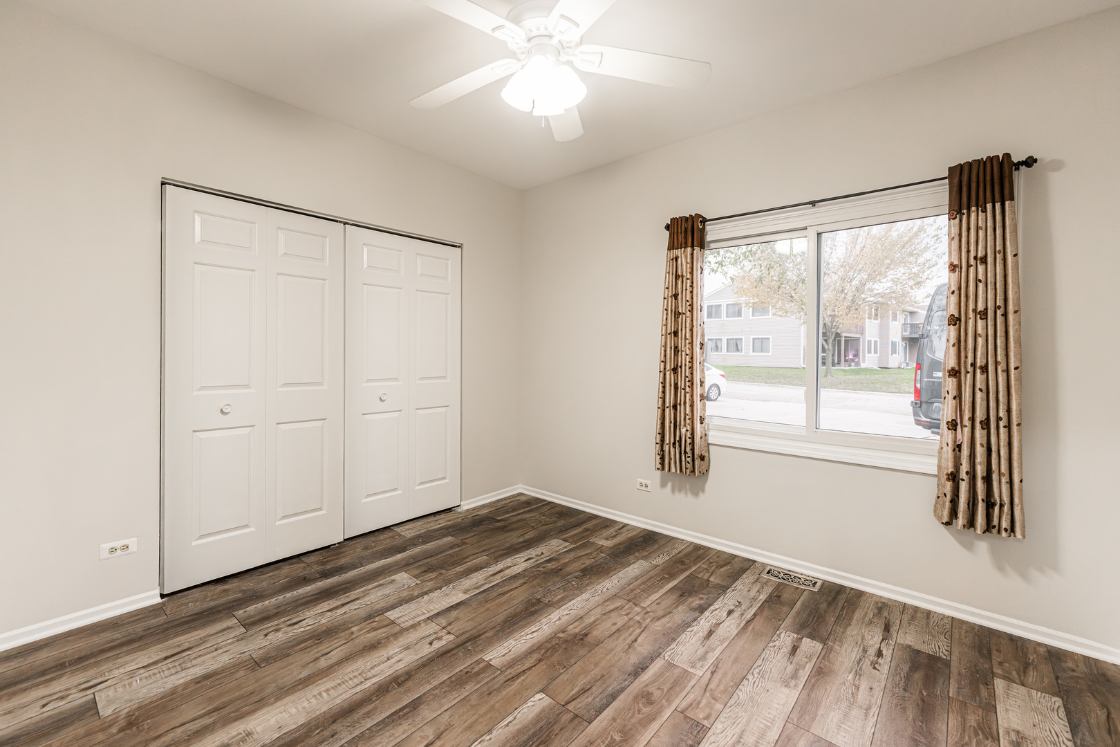 112 Morningside Lane West Buffalo Grove, IL 60089 - Photo 21 of 35 a view of empty room with wooden floor and fan