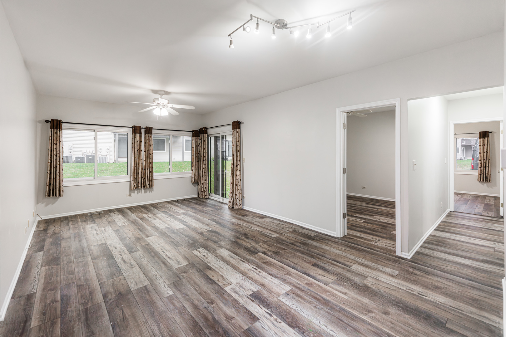 112 Morningside Lane West Buffalo Grove, IL 60089 - Photo 9 of 35 wooden floor in an empty room with a window