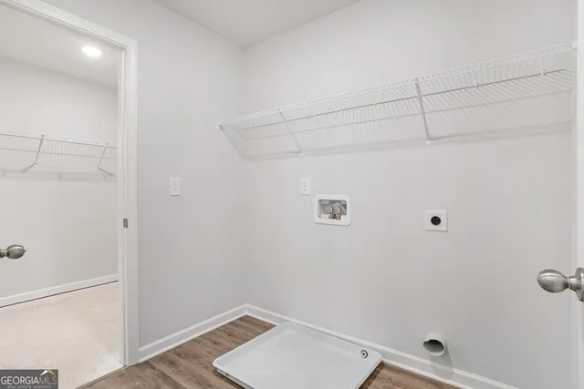 a view of a utility room with racks on the wall