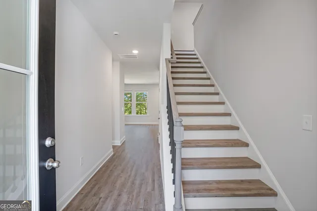 a view of entryway with wooden floor