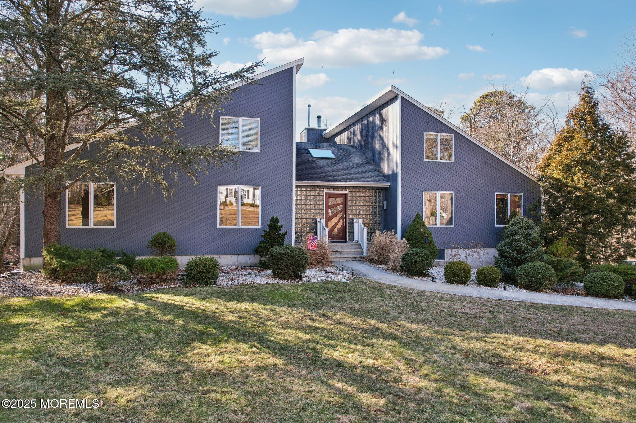 47 Brookside Road Millstone Township, NJ 08510 - Photo 1 of 3 a front view of a house with a yard