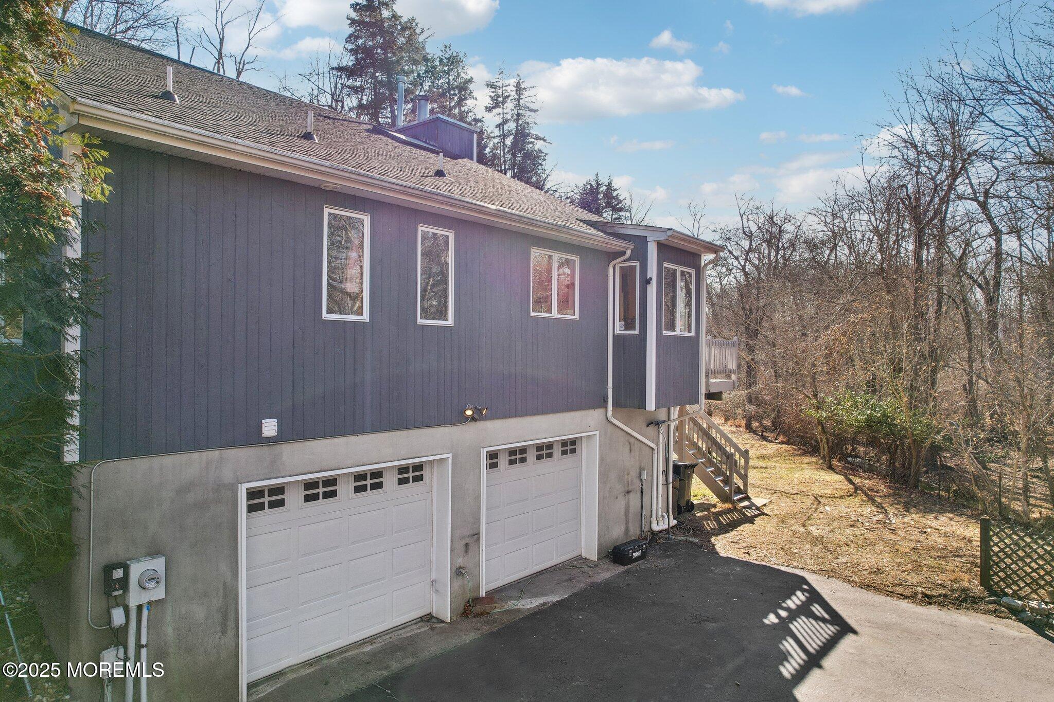 47 Brookside Road Millstone Township, NJ 08510 - Photo 2 of 3 a view of a house with backyard and sitting area