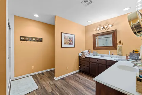 a bathroom with a glass shower door