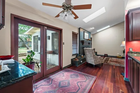 a dining room with furniture and window