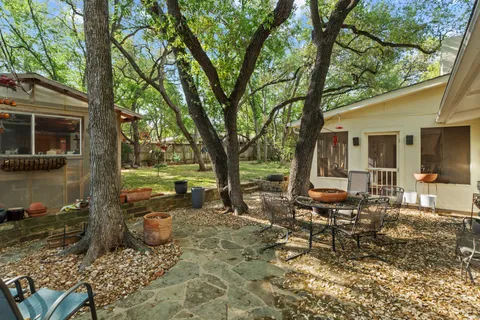 a house with trees in the background