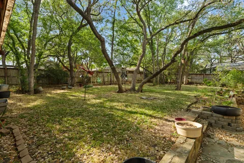 a backyard of a house with lots of green space
