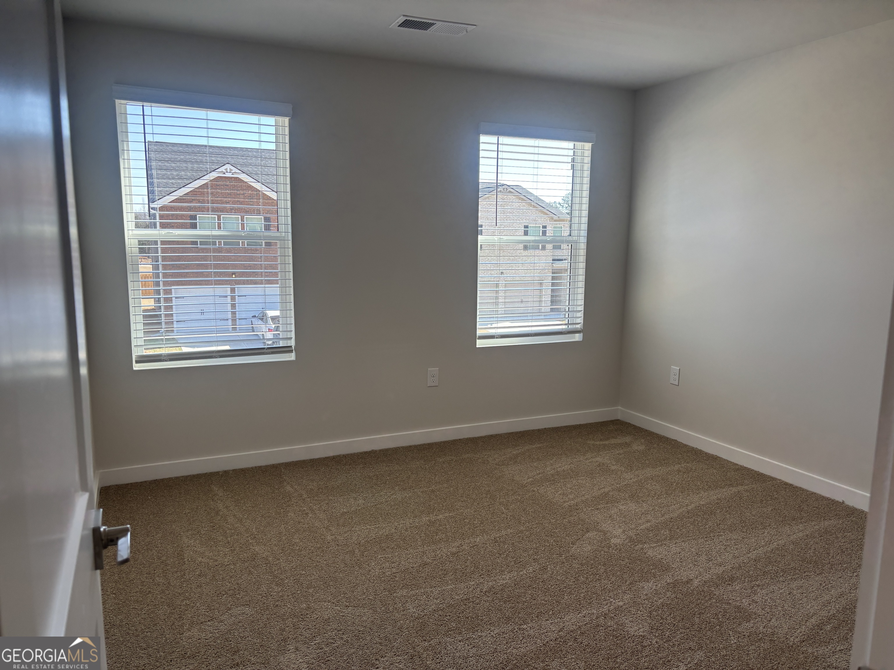 5349 Tolar Road South Fulton, GA 30213 - Photo 18 of 36 an empty room with a window