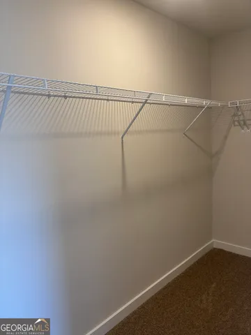 a view of a room with racks on the wall