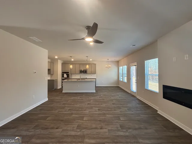 a view of a kitchen with a sink and cabinets