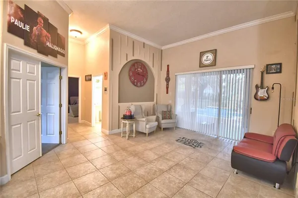 a dining room with furniture a rug and a chandelier