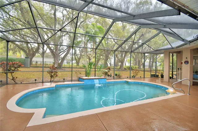 a white house that has a tree in front of it