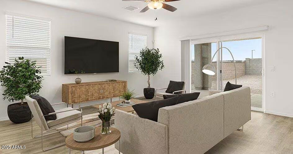 25200 North 151st Drive, Unit 4 Surprise, AZ 85387 - Photo 2 of 14 a living room with furniture a flat screen tv and a large window