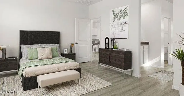 a bedroom with a bed and a television