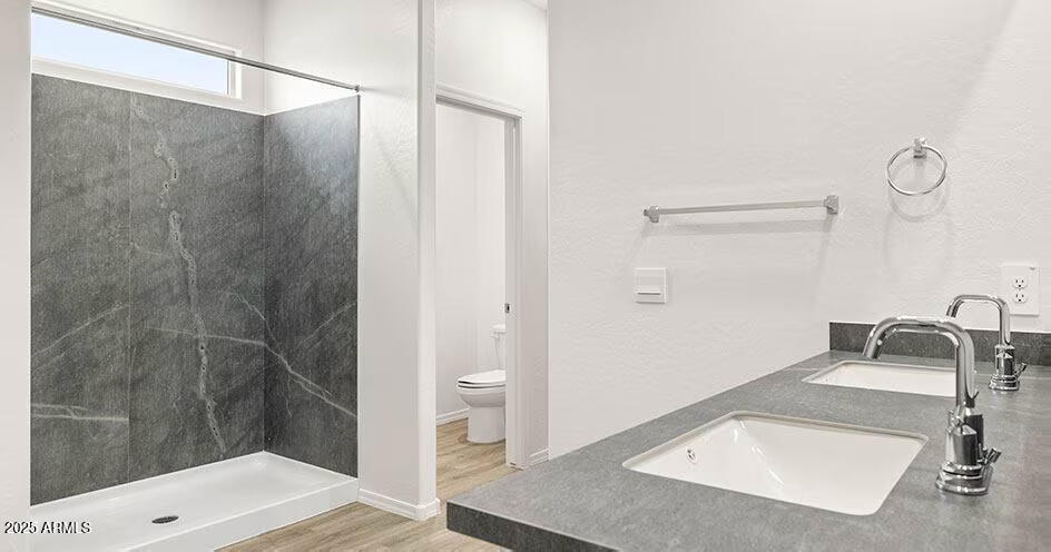 25200 North 151st Drive, Unit 4 Surprise, AZ 85387 - Photo 6 of 14 a bathroom with a sink and a mirror