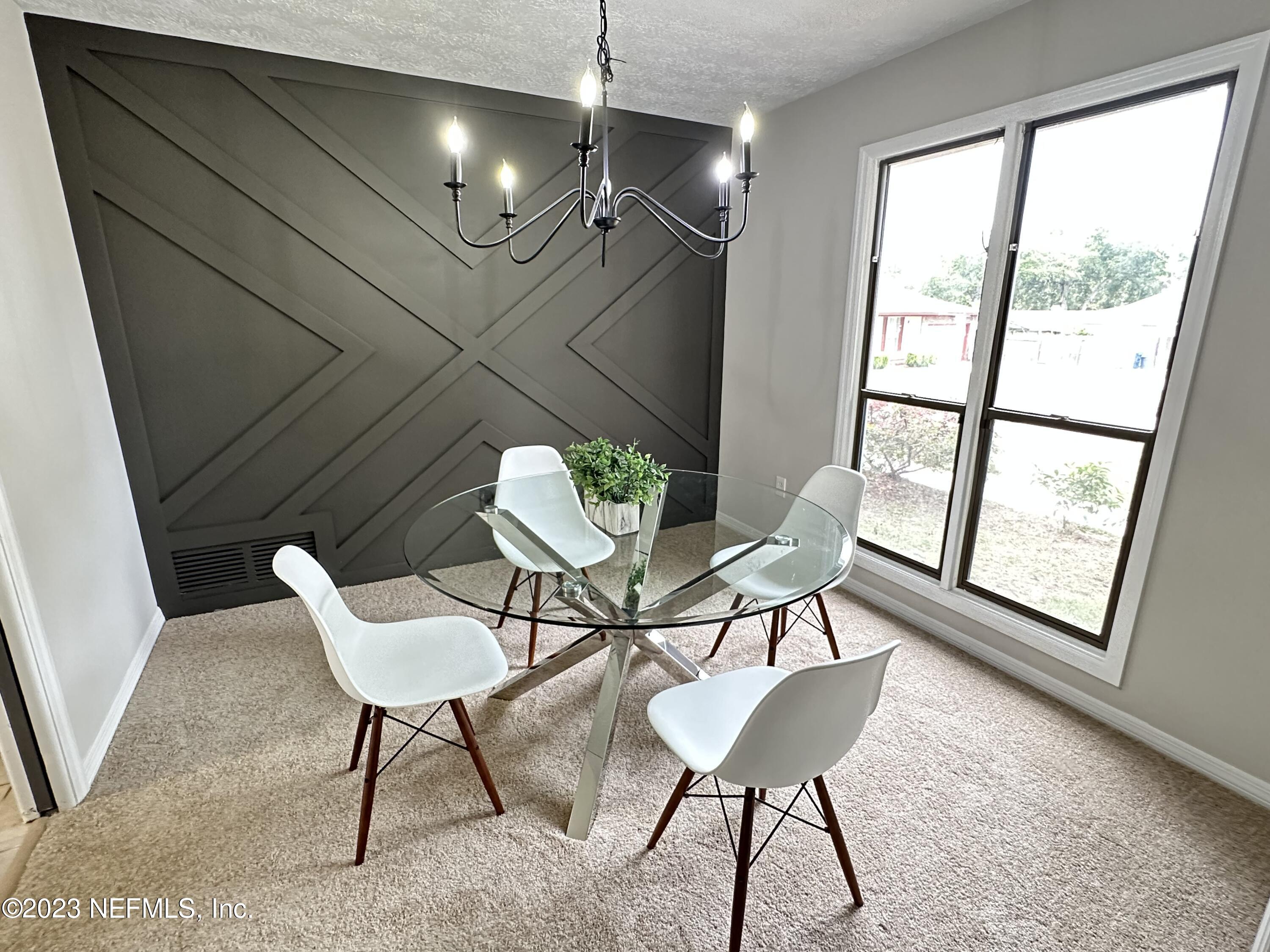 6175 Briar Forest Road West Jacksonville, FL 32277 - Photo 11 of 36 a view of a livingroom with furniture window and wooden floor