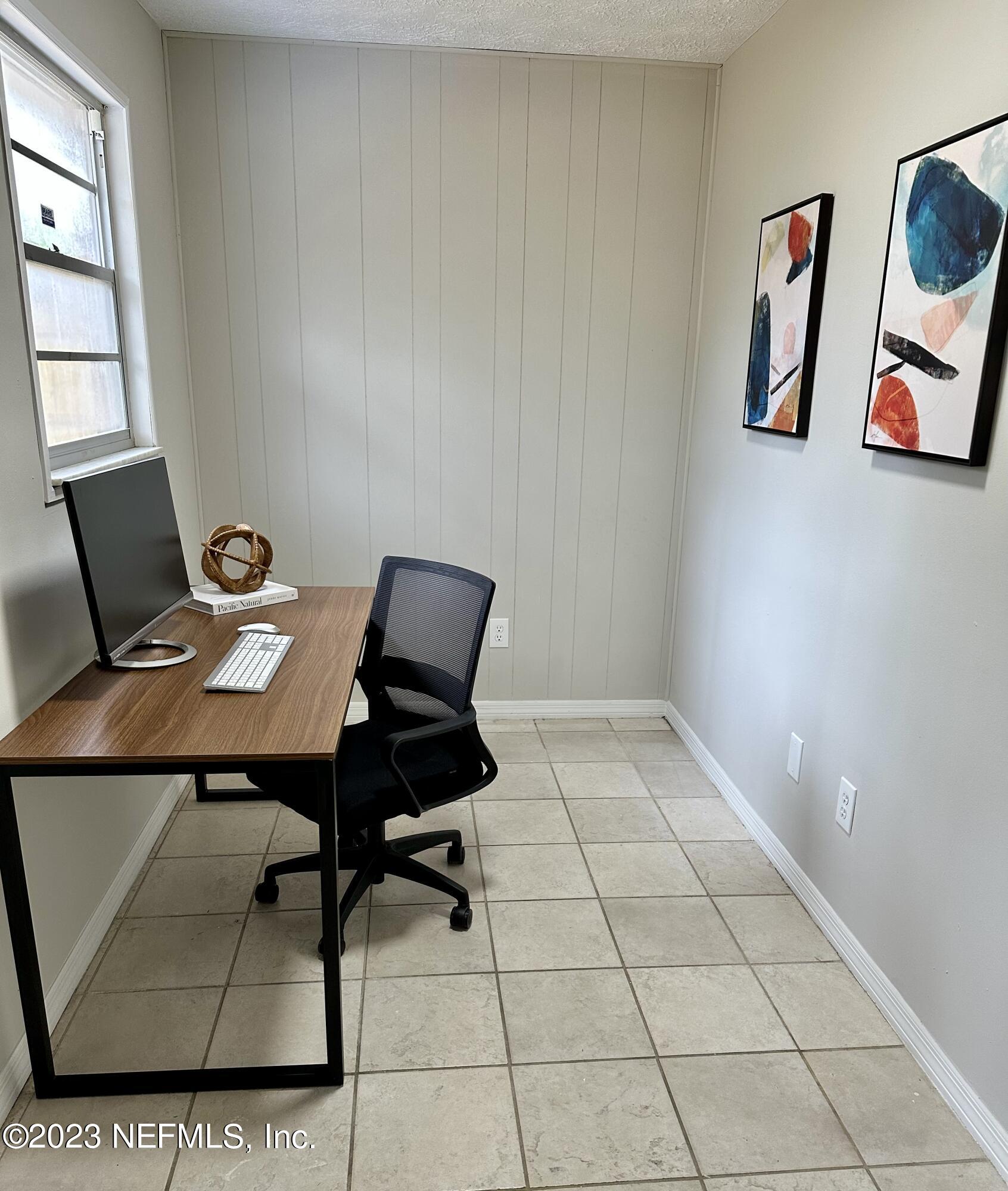 6175 Briar Forest Road West Jacksonville, FL 32277 - Photo 18 of 36 a view of a workspace with furniture
