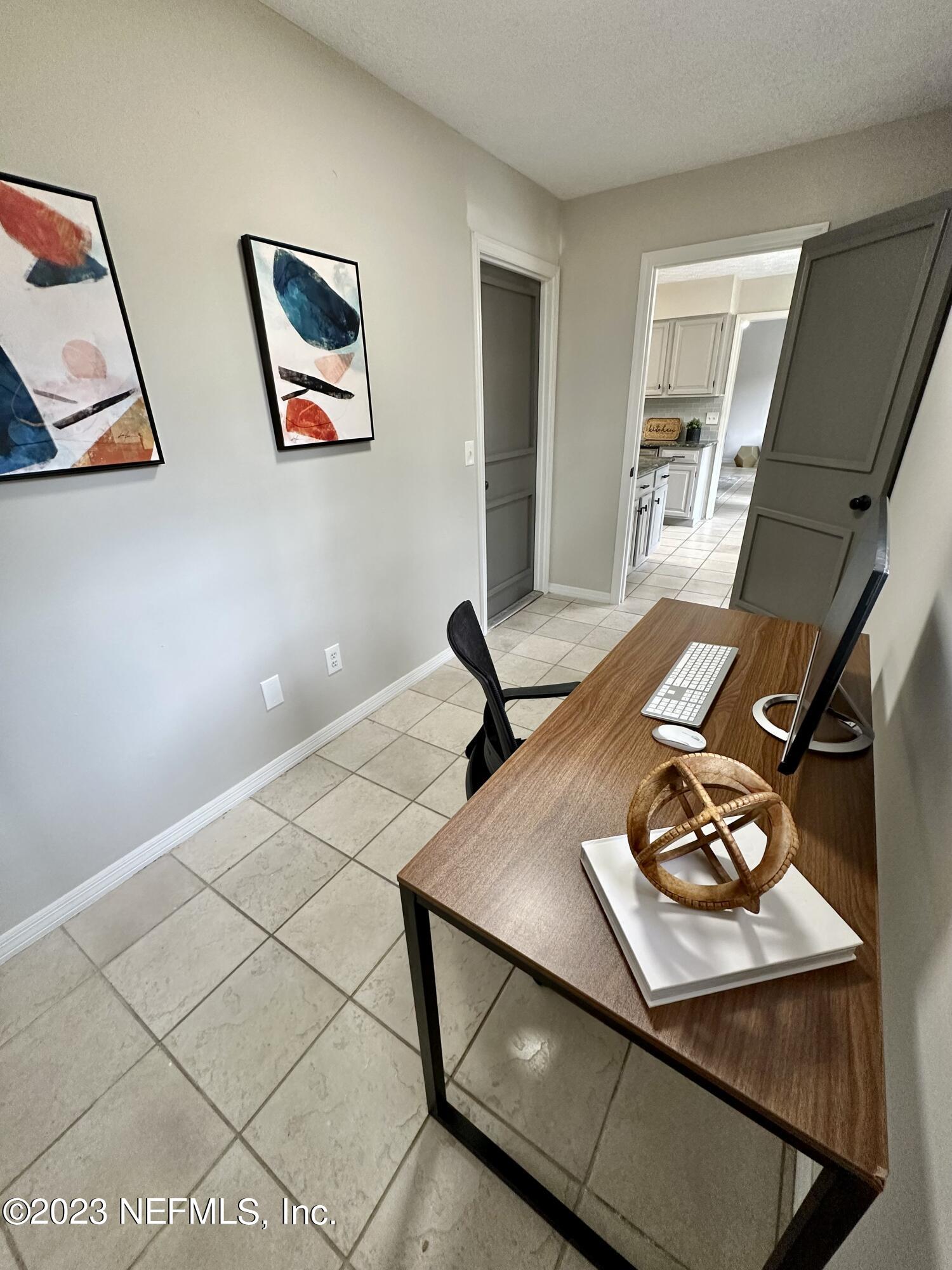 6175 Briar Forest Road West Jacksonville, FL 32277 - Photo 19 of 36 a view of workspace with furniture