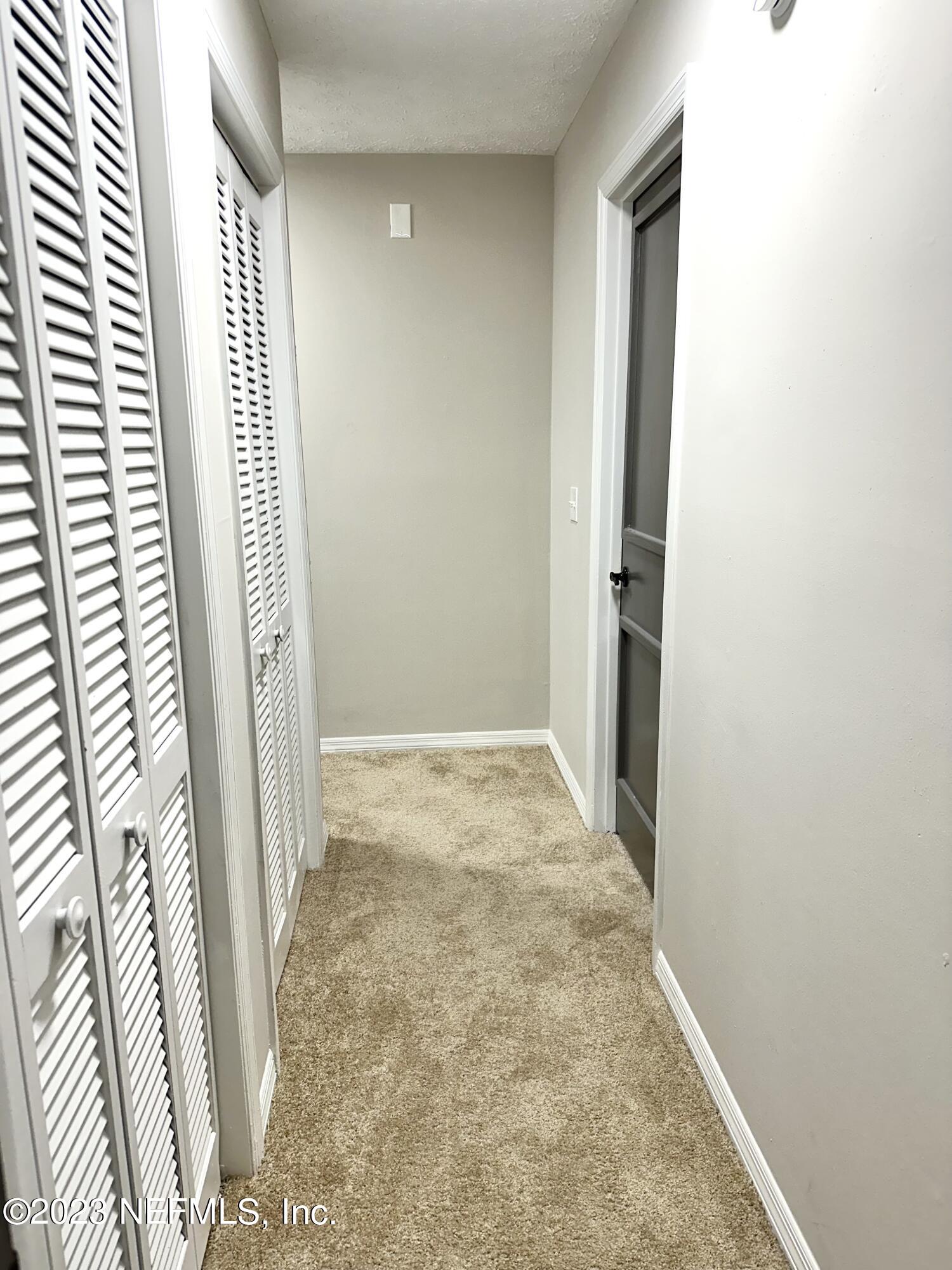 6175 Briar Forest Road West Jacksonville, FL 32277 - Photo 23 of 36 an empty room with windows