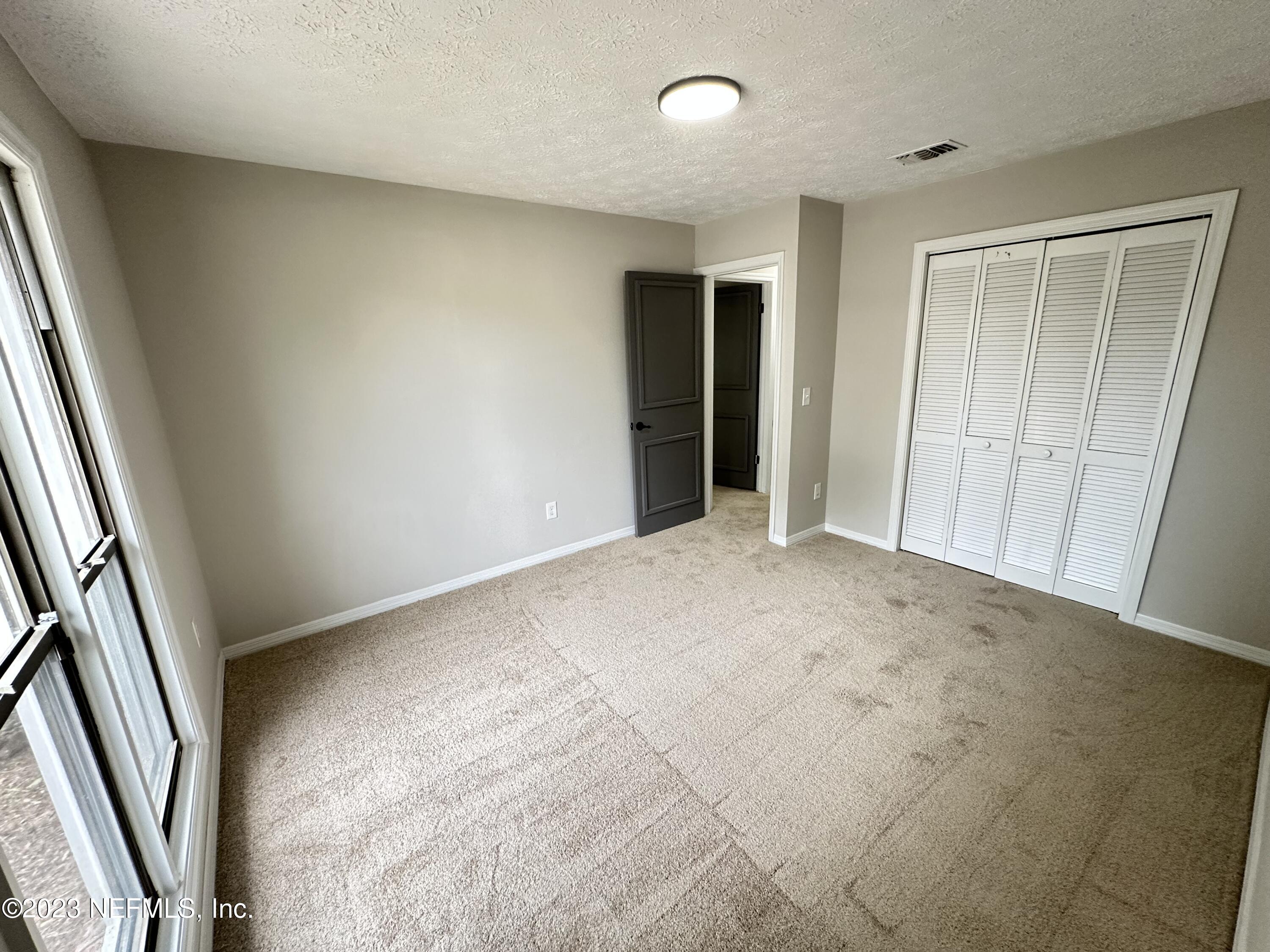 6175 Briar Forest Road West Jacksonville, FL 32277 - Photo 33 of 36 an empty room with window