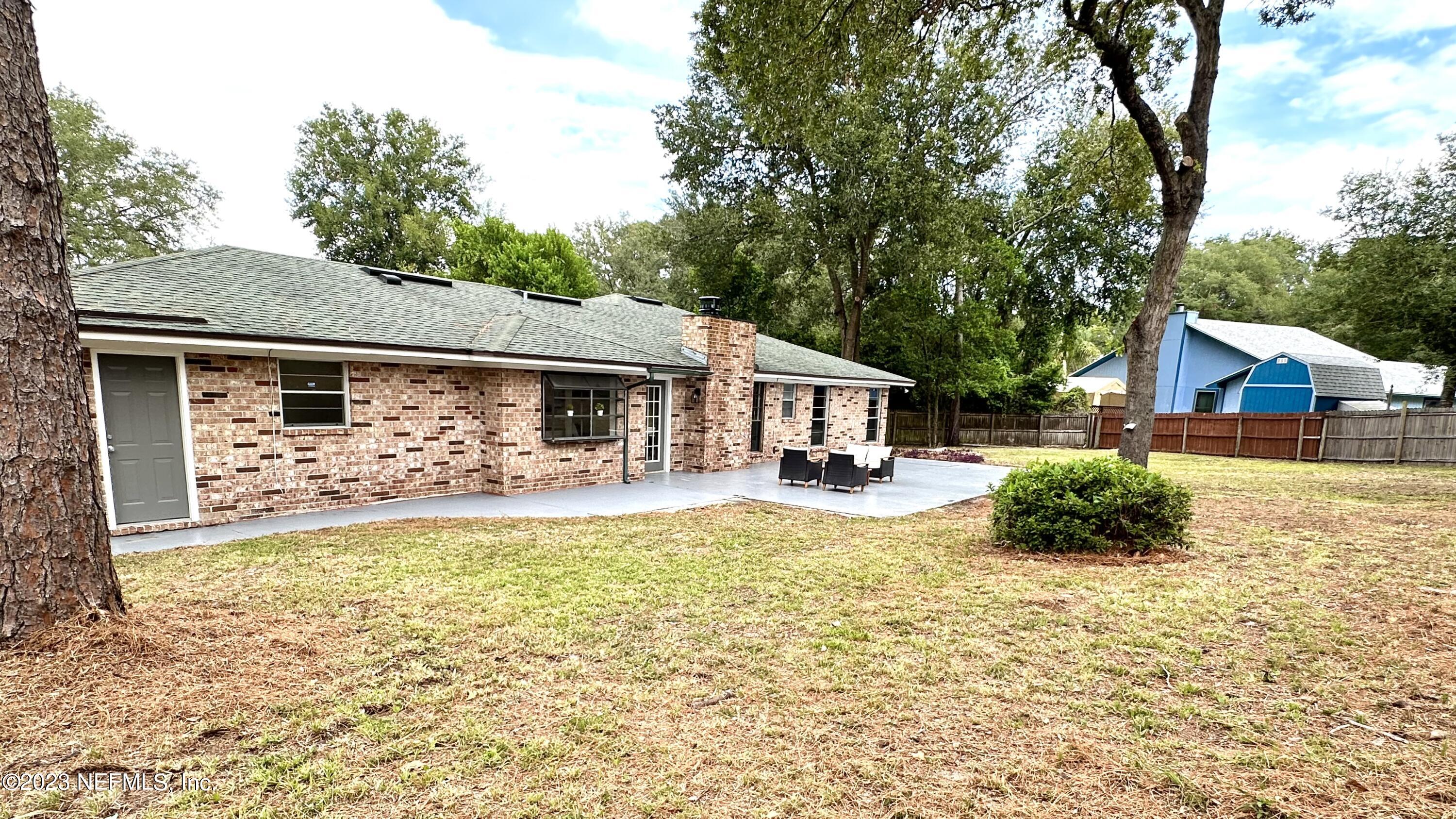 6175 Briar Forest Road West Jacksonville, FL 32277 - Photo 35 of 36 a front view of a house with a yard