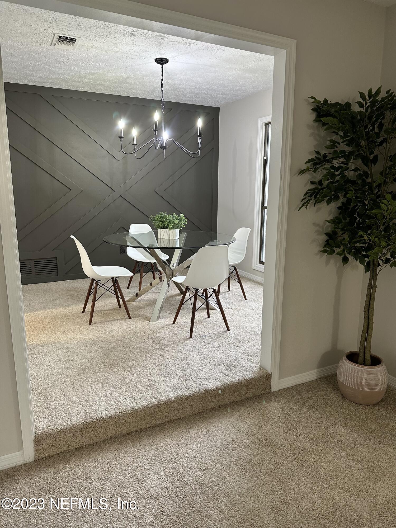 6175 Briar Forest Road West Jacksonville, FL 32277 - Photo 10 of 36 a view of a livingroom with furniture and entryway