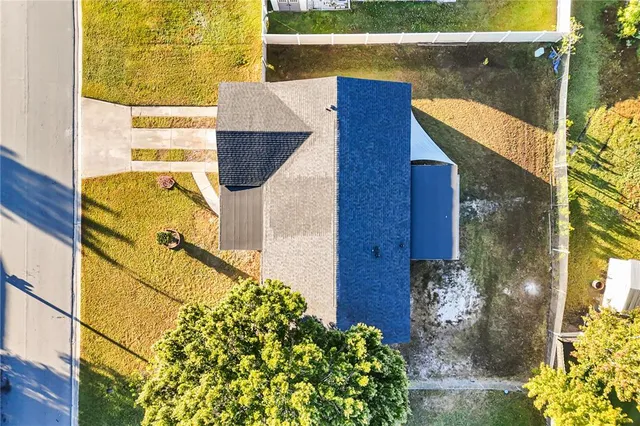 an aerial view of a house with a lake view