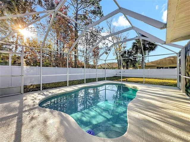 a view of a swimming pool with a patio