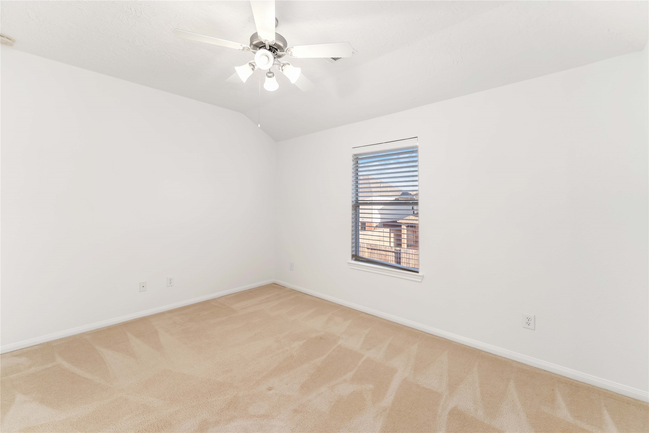 7226 VORGEN Court Spring, TX 77379 - Photo 34 of 45 an empty room with windows and fan