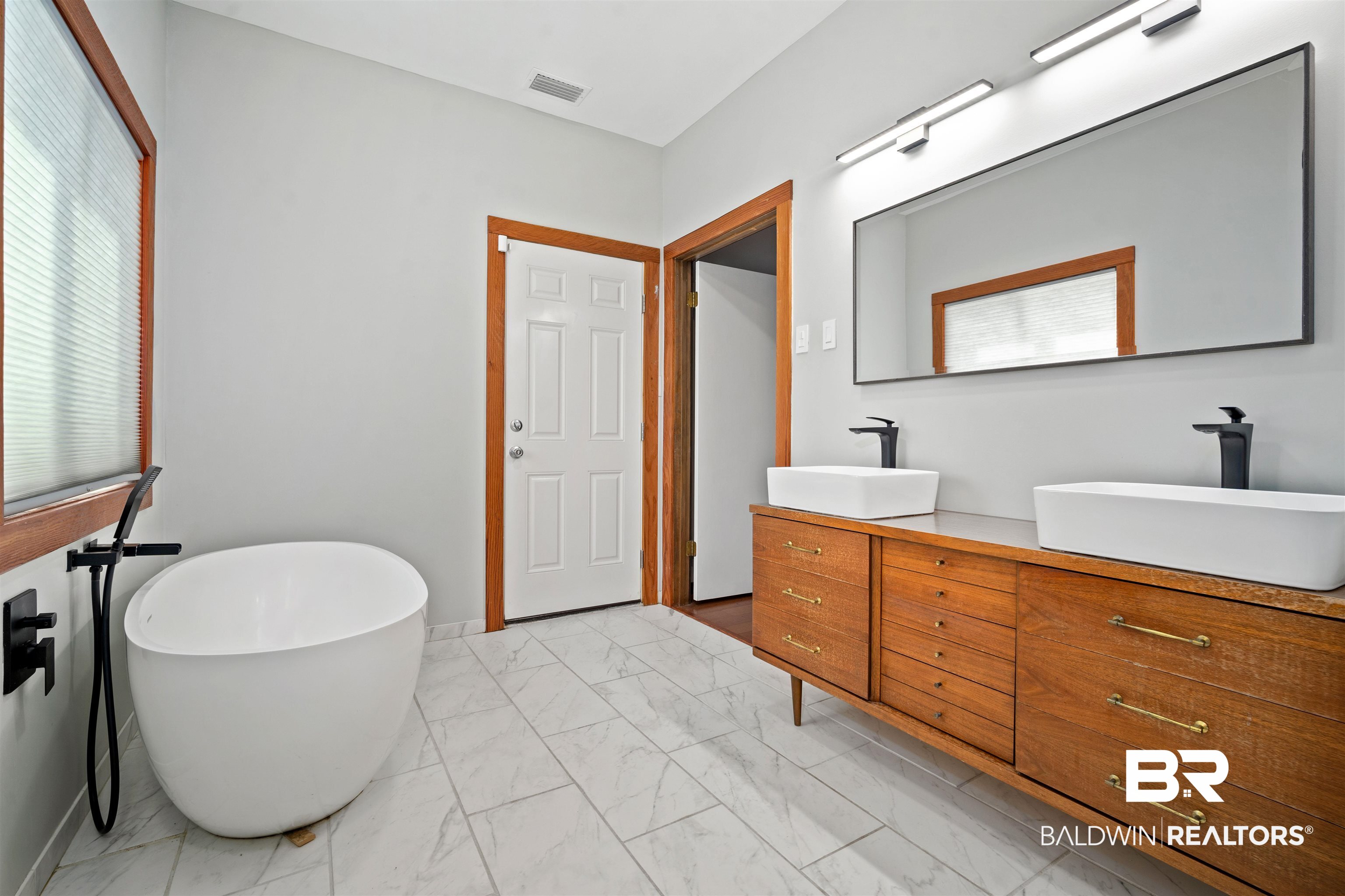 7912 Yorkhaven Road Mobile, AL 36695 - Photo 20 of 41 Bathroom with light marble finish floors, a freestanding bath, and double vanity