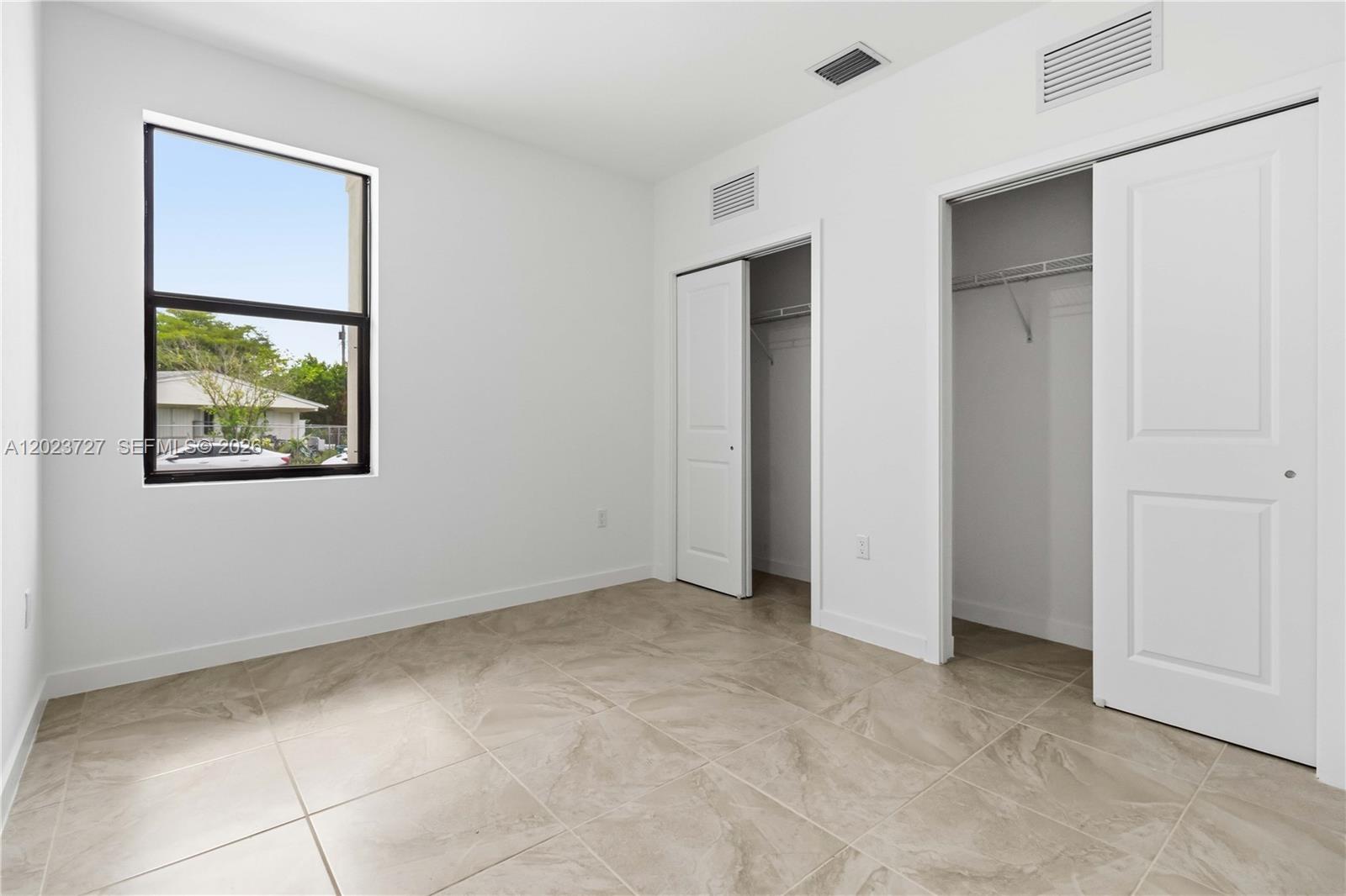 22348 Southwest 115th Court, Unit 22348 Miami, FL 33170 - Photo 29 of 37 a view of an empty room with a window