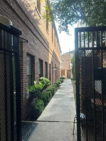 a view of a brick house many windows