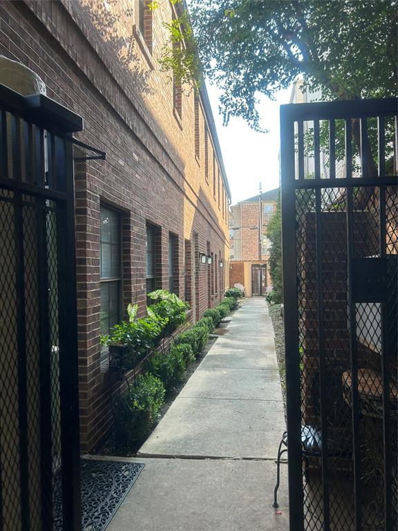 a view of a brick house many windows