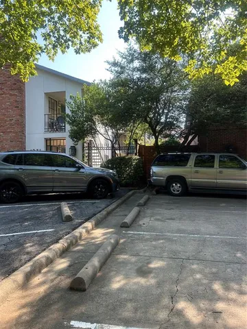 a view of a car parked in front of a house