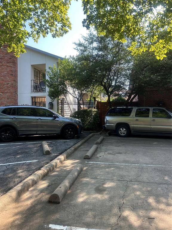 4231 Gilbert Avenue Dallas, TX 75219 - Photo 3 of 14 a view of a car parked in front of a house