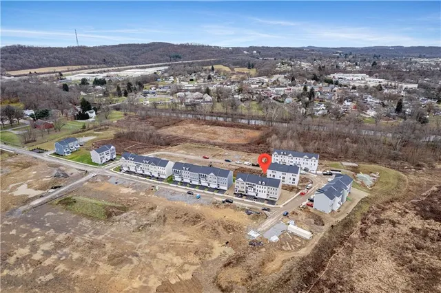 an aerial view of residential house with outdoor space