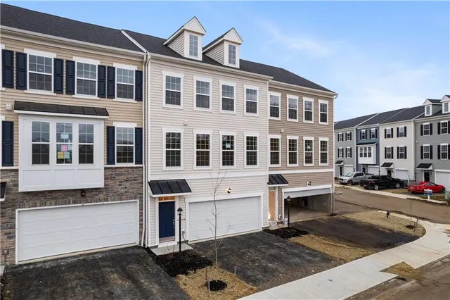a front view of a building with glass windows