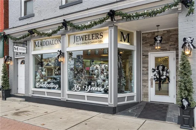 a front view of a building with many windows