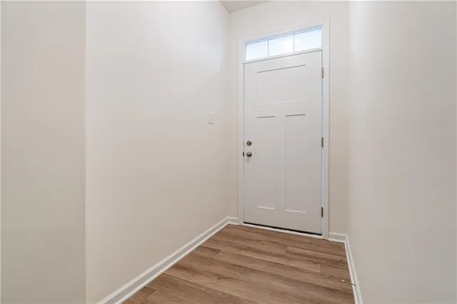 a view of a small space with wooden floor