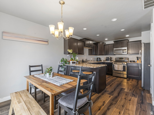 12214 Sunpark Lane Draper, UT 84020 - Photo 6 of 24 Dining area with dark wood finished floors and hanging lights