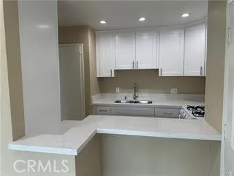 a kitchen with a sink and cabinets
