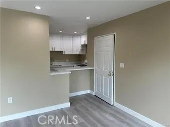 a view of kitchen with wooden floor