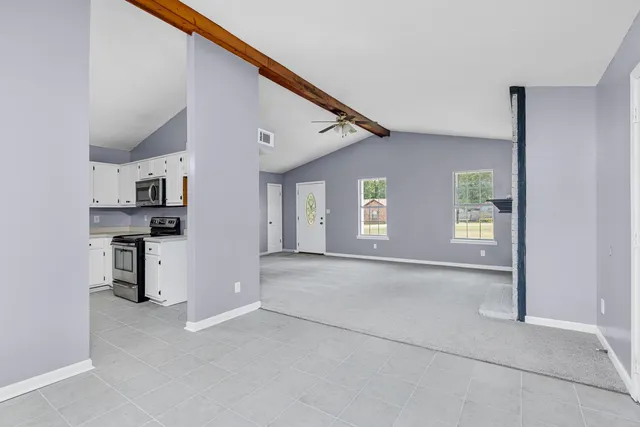 a view of a kitchen with furniture and window