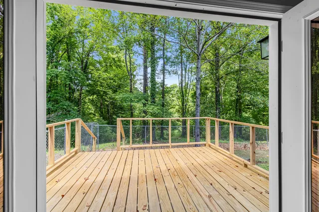 a view of balcony with deck and wooden floor