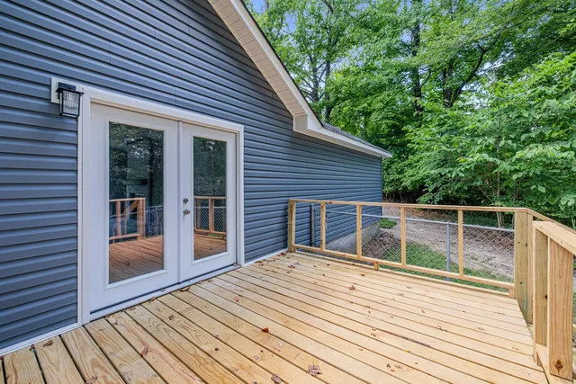 a backyard of a house with wooden floor