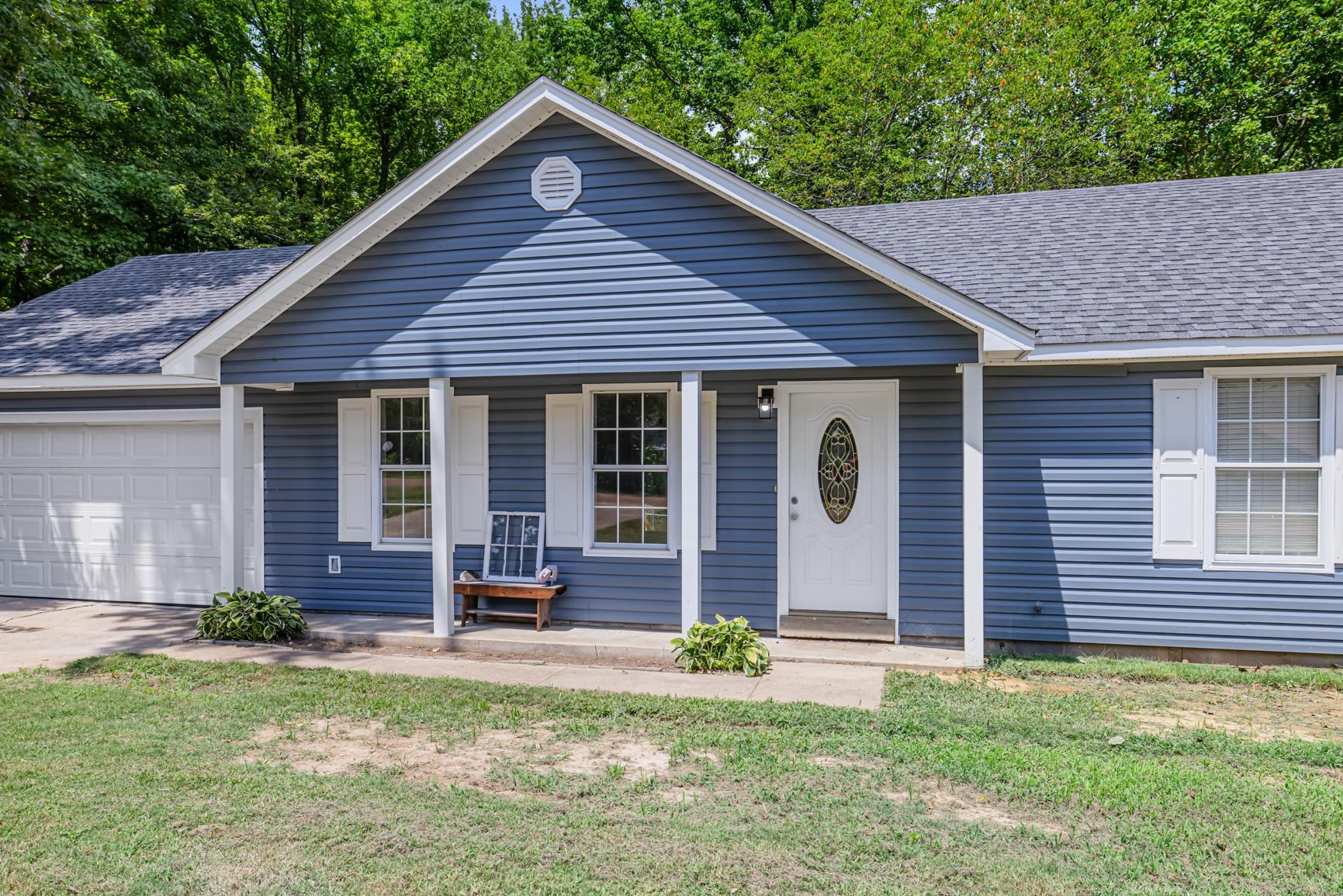 260 Chisolm Trail Road Atoka, TN 38004 - Photo 3 of 30 a front view of a house with garden
