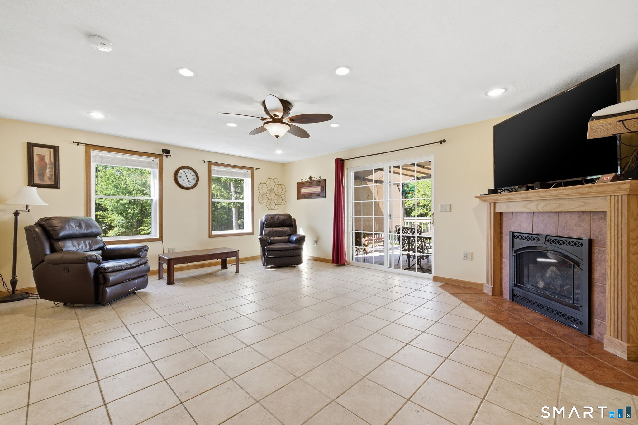 141 Hop River Road Coventry, CT 06238 - Photo 3 of 40 a living room with furniture and a flat screen tv