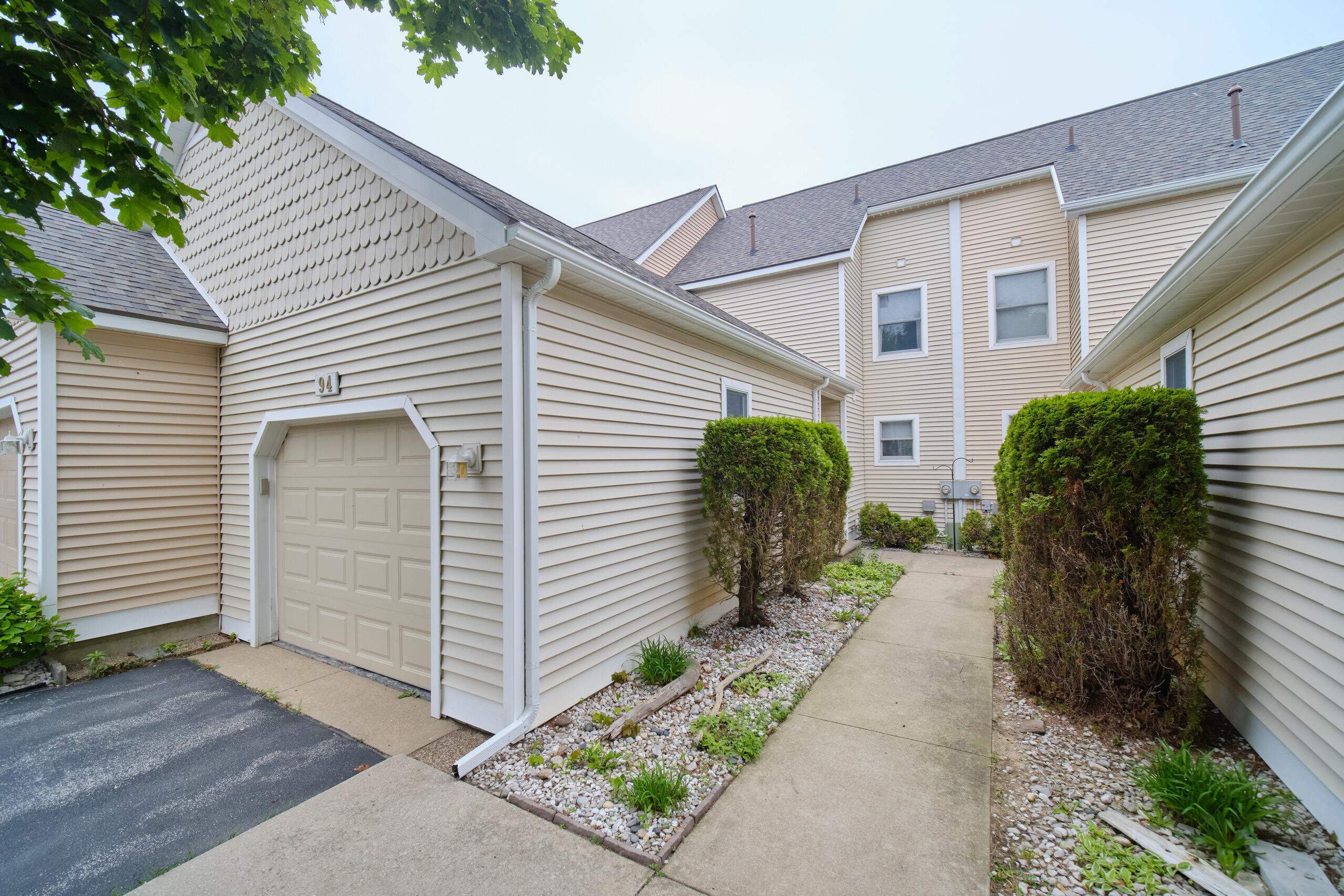 94 Charter Court Manistee, MI 49660 - Photo 2 of 52 Condo Garage & entry