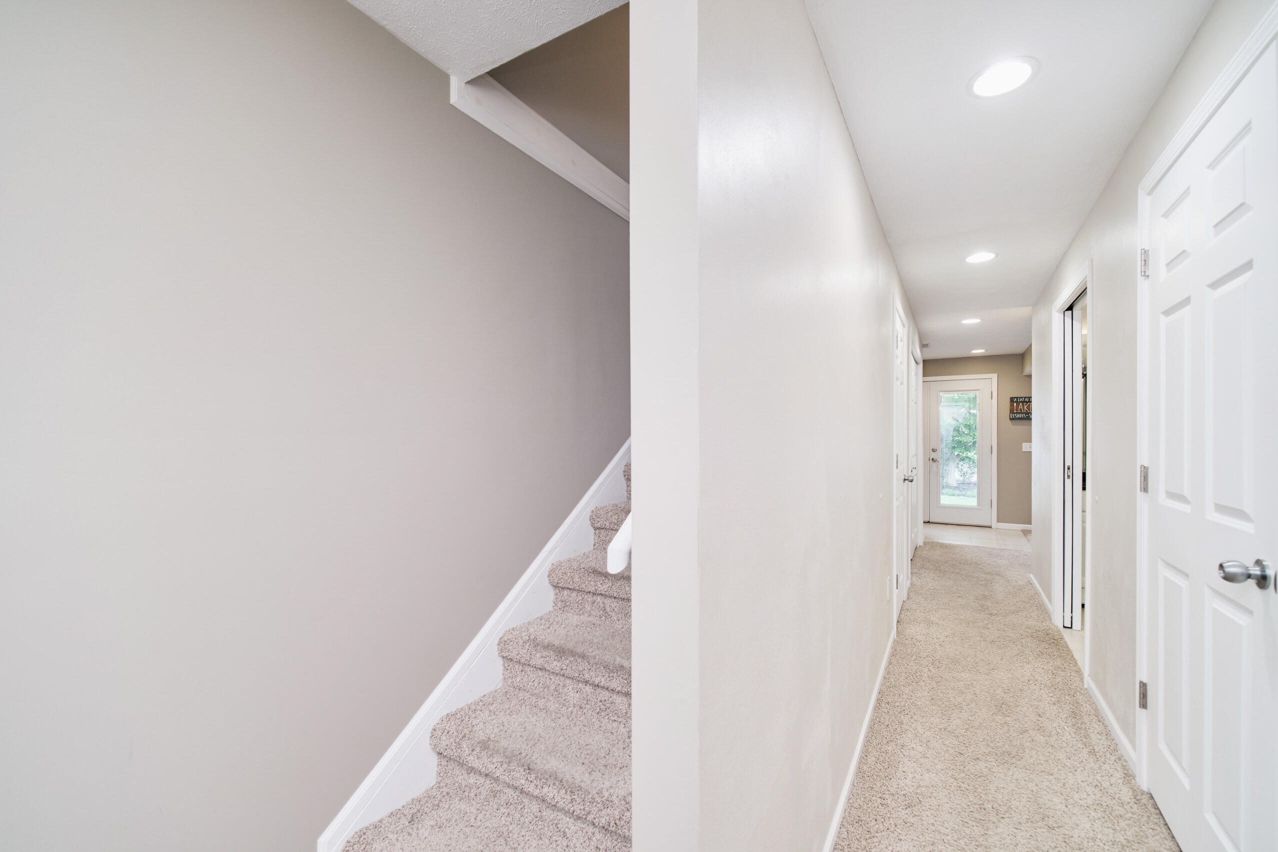 94 Charter Court Manistee, MI 49660 - Photo 37 of 52 Stairs & Hallway lower level