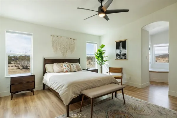 a bedroom with a bed and a table in it