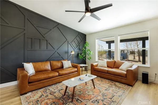 a couch sitting in a living room with a couch and a table